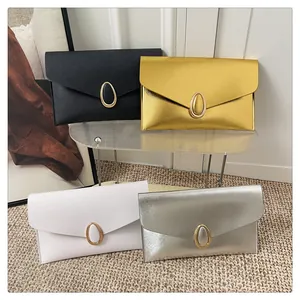 Detail view of stylish envelope clutch bags in black, gold, white and silver finishes