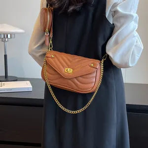 Brown crossbody bag set with V-shaped quilting, gold turn-lock and small round coin purse