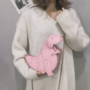 Pink dinosaur shaped crossbody bag with gold studs and metal chain strap for women