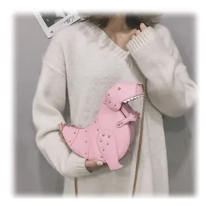 Pink dinosaur crossbody bag for women with gold rivet details and chain strap
