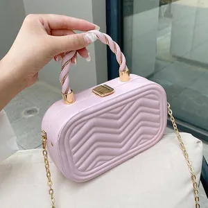 Chic light pink box bag with wave patterns and golden chain strap for women
