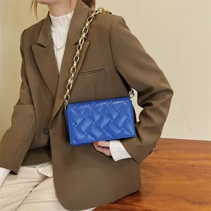 Royal blue quilted leather crossbody bag with chunky gold chain strap for women