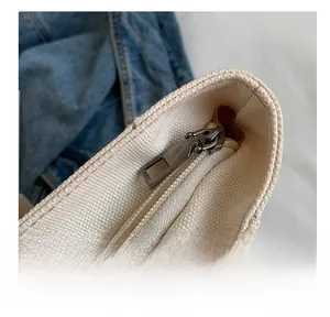 Detail showing high-quality smooth silver metal zipper and durable thick canvas texture