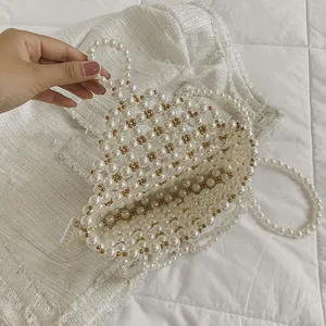 Handmade pearl woven shoulder bag with gold beads and elegant strap for women