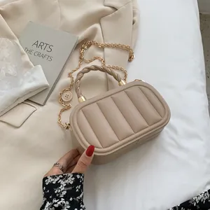 Beige quilted leather small square bag with woven handle and gold chain strap detail