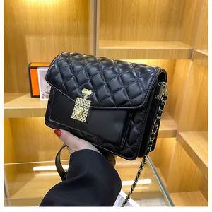 Classic black quilted crossbody bag with perfume bottle gold clasp and chain strap
