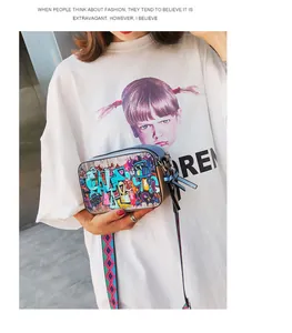 Detail view of graffiti style camera bag with colorful wide strap and double zipper closure