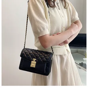 Classic black quilted crossbody bag with gold chain strap and elegant metallic push-lock