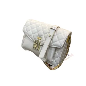 Quilted cream crossbody bag with gold perfume bottle twist lock and chain strap