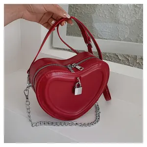 Chic red heart-shaped quilted mini crossbody bag with silver chain and handle