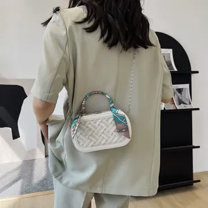 White woven texture handbag with chain strap and decorative silk scarf handle accessory