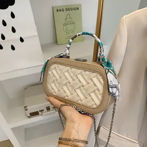 Chic beige woven satchel bag with silk scarf handle and metal chain strap for women