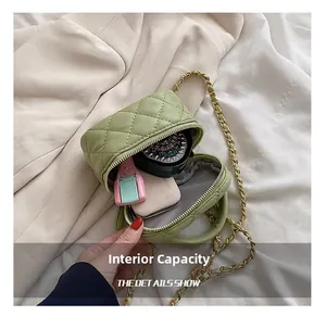 Detail of green quilted mini chain bag interior showing space for makeup and compacts