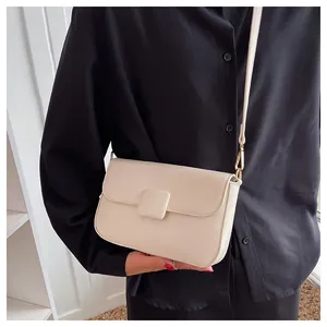 Chic cream white leather flap bag detail with square buckle on black shirt