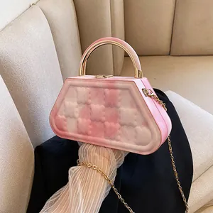 Pink and white checkerboard textured small square handbag with gold round metal handle