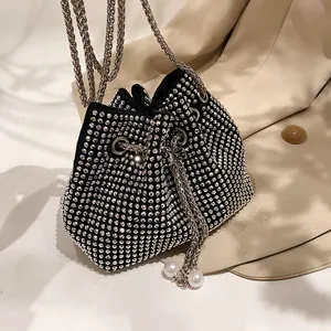 Chic black bucket bag with silver rhinestones, metal chain strap and pearl accents