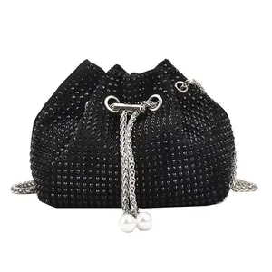 Fashionable black rhinestone bucket bag with silver chain strap and pearl drawstring