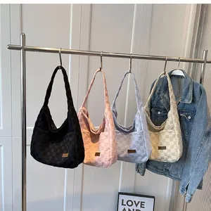 Hanging checkered tote bags in four colors showing soft cotton texture and hobo style