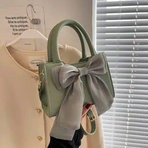 Light green handbag with a large grey organza bow, stylish small square crossbody purse