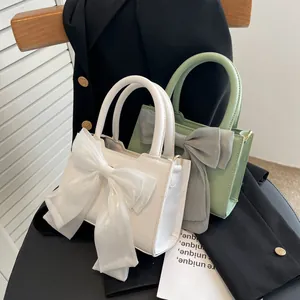 Chic mini square handbags in white and light green with oversized organza bows