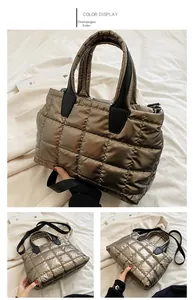 Detailed views of champagne quilted tote bag with square stitching and black straps