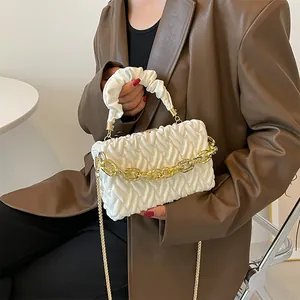White quilted cloud handbag with ruffled handle and chunky gold chain strap for women