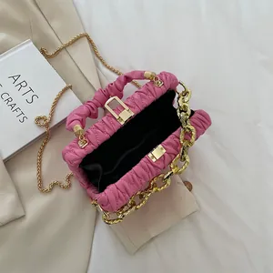 Pink pleated crossbody bag for women featuring chunky gold chain and metal lock