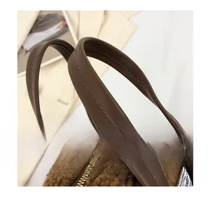 Detail of brown faux fur handbag with premium PU leather handle and sturdy metal zipper