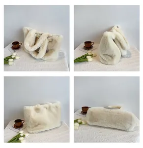 Detail view showing soft plush texture and thick handles of the cream white tote bag