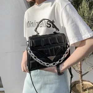 Classic black quilted crossbody bag with chunky silver chain and wide top handle