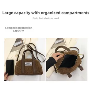 Detail view of large capacity brown plush tote bag showing interior zipper and phone size comparison