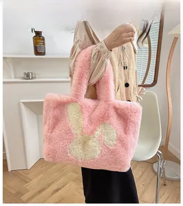 Detail of pink plush tote bag showing soft faux fur texture and cute bunny pattern