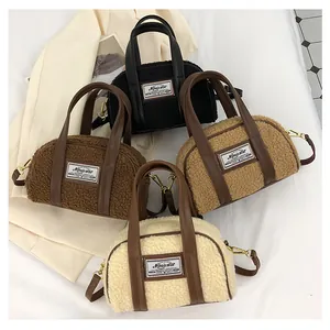 Flat lay of plush faux shearling handbags in black, brown, khaki, and cream colors
