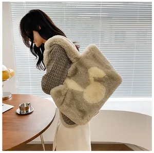 Detail of grey plush tote bag featuring a cute cartoon duck and soft faux fur texture