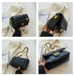 Detail view of black quilted crossbody bag with gold twist lock and chain strap