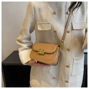 Detail of the light brown PU leather crossbody bag featuring vintage croc-embossed texture