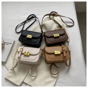 Detail of crossbody bags in four colors with crocodile pattern and gold metal buckle