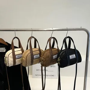 Plush faux shearling crossbody bags in cream, khaki, brown and black colors