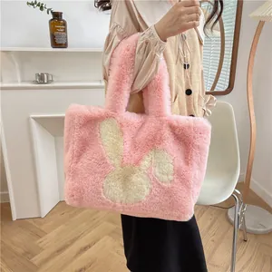 Pink plush bunny tote bag with soft faux fur material and a cute rabbit pattern