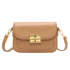 Minimalist khaki leather handbag with crocodile pattern and golden chocolate buckle detail