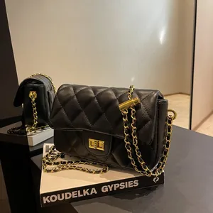 Classic black quilted crossbody bag with gold chain strap and elegant metal twist lock