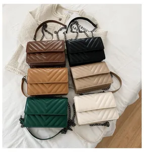 Close-up of elegant V-quilted handbags in six colors with metallic chain straps