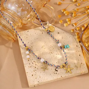 Collier de plage fait main avec pendentifs étoile de mer, perles et perles bleues