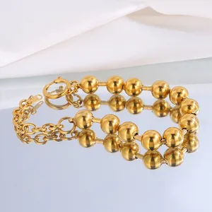Luxurious 18k gold plated stainless steel bead bracelet with adjustable chain on mirror
