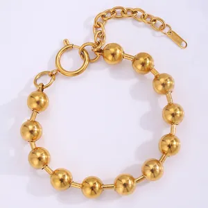 Detailed close-up of 18k gold plated stainless steel bead bracelet with lobster clasp