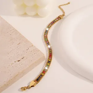 Detail of gold titanium chain bracelet featuring multi-color crystals and adjustable lobster clasp