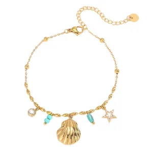 Bracelet en acier titane doré avec coquillage, étoile, perles bleues et zircone brillante