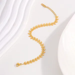 Detail of golden leaf chain bracelet with matte finish links and lobster clasp closure