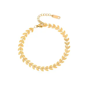 Gold leaf-shaped stainless steel chain bracelet with lobster clasp on white background