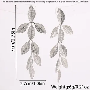 Detailed sizing chart for silver leaf tassel earrings showing 7cm length and 2.7cm width